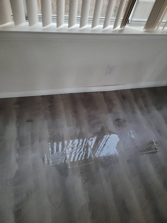 Water on vinyl plank flooring after flood