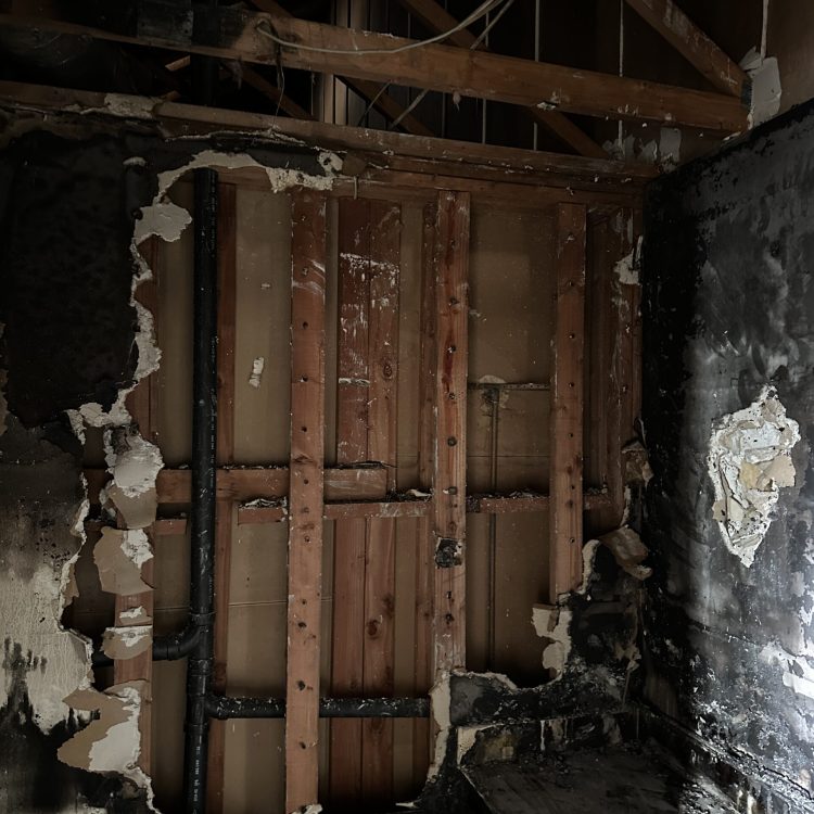 Exposed Framing after Fire Fire damage destroys wall and exposes framing